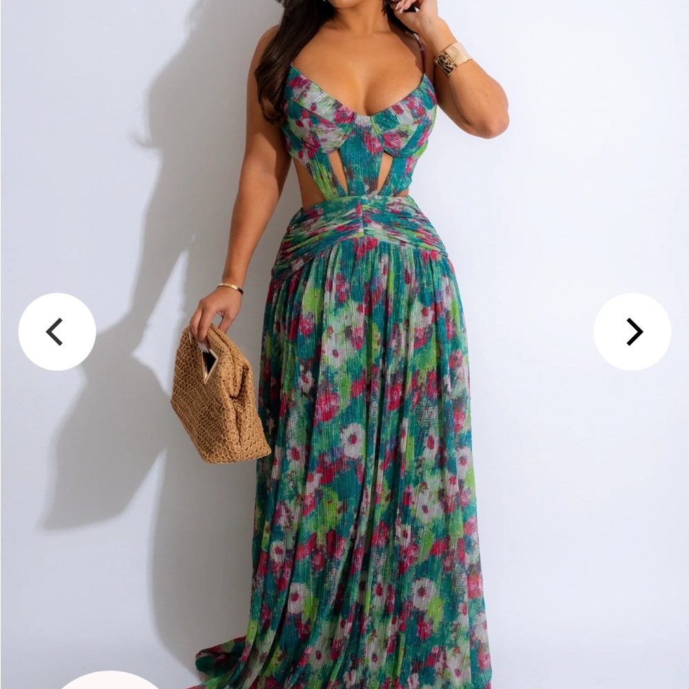Floral maxi dress with cutouts. Brand new with tags. Very beautiful.